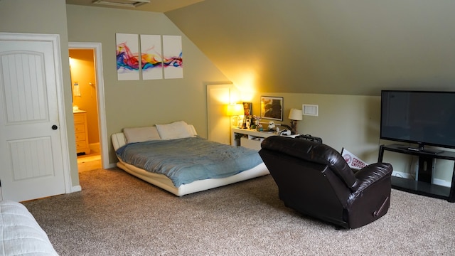 bedroom with vaulted ceiling and carpet flooring