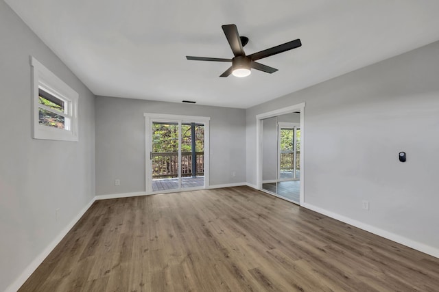 spare room featuring ceiling fan and light hardwood / wood-style flooring