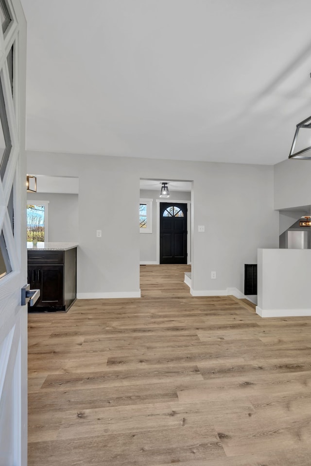 living room with light hardwood / wood-style flooring and plenty of natural light