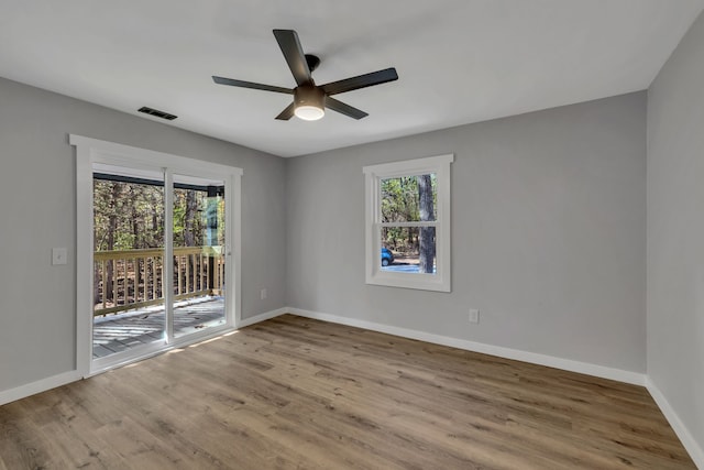 unfurnished room featuring ceiling fan and wood-type flooring