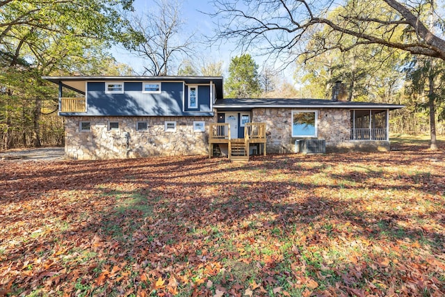 back of house featuring central AC unit