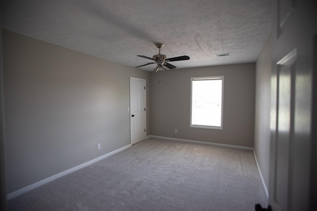 1805 Pointe Ct, Lebanon, TN 37087 - unfurnished room featuring carpet floors, baseboards, ceiling fan, and a textured ceiling