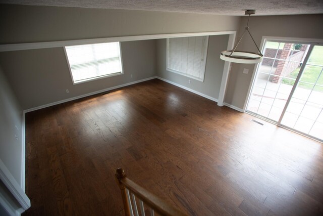1805 Pointe Ct, Lebanon, TN 37087 - unfurnished room featuring dark wood-style flooring, baseboards, and a textured ceiling