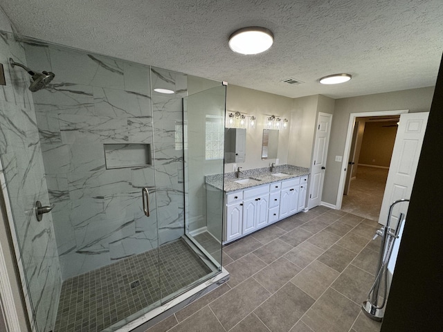 1805 Pointe Ct, Lebanon, TN 37087 - full bathroom with a marble finish shower, baseboards, double vanity, and a textured ceiling