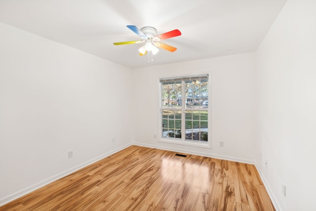 unfurnished room with ceiling fan and light hardwood / wood-style floors