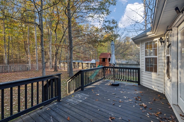 wooden terrace with a playground