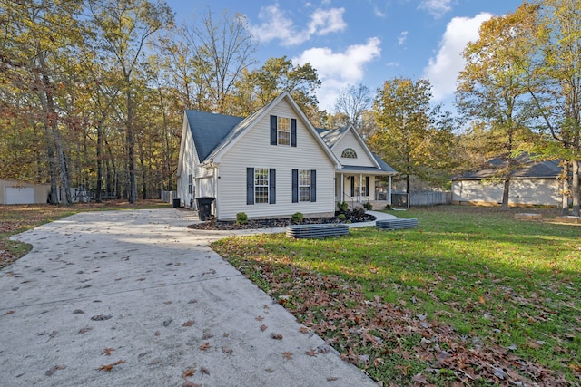 view of front of home with a porch and a front yard