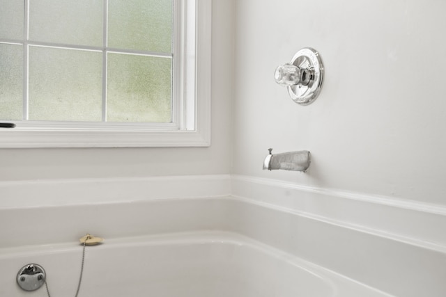 bathroom with a bathing tub