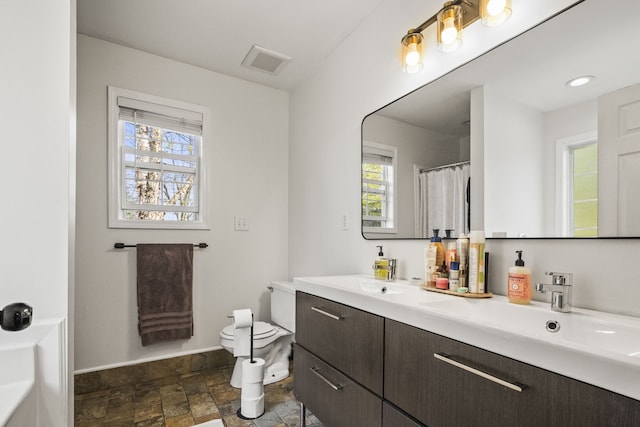 bathroom with vanity and toilet