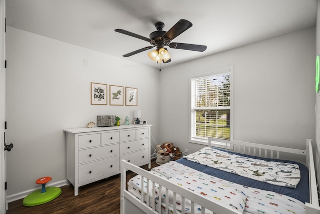 bedroom featuring dark hardwood / wood-style flooring and ceiling fan