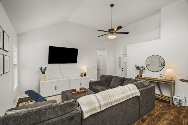 living room with dark hardwood / wood-style flooring, ceiling fan, and lofted ceiling