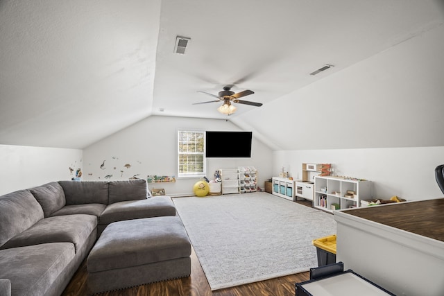 living room featuring hardwood / wood-style floors, ceiling fan, and vaulted ceiling