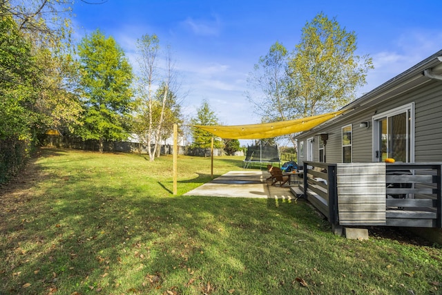 view of yard featuring a patio and a trampoline