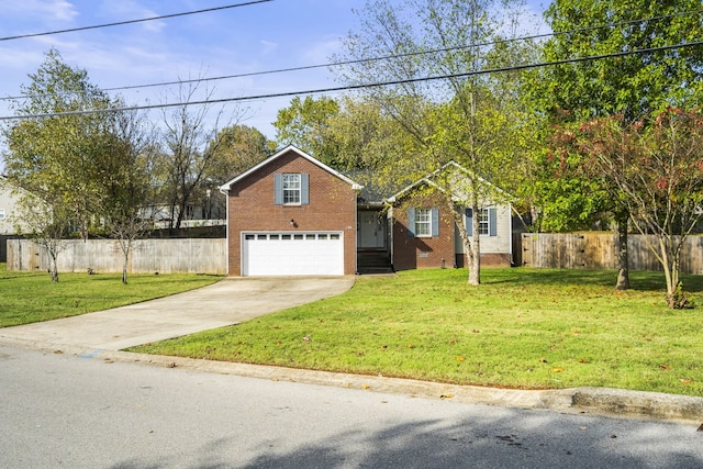 view of front of house with a garage and a front yard