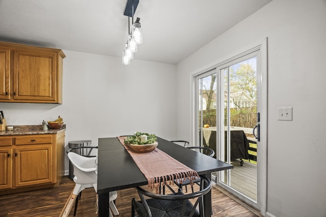 dining space featuring dark hardwood / wood-style flooring