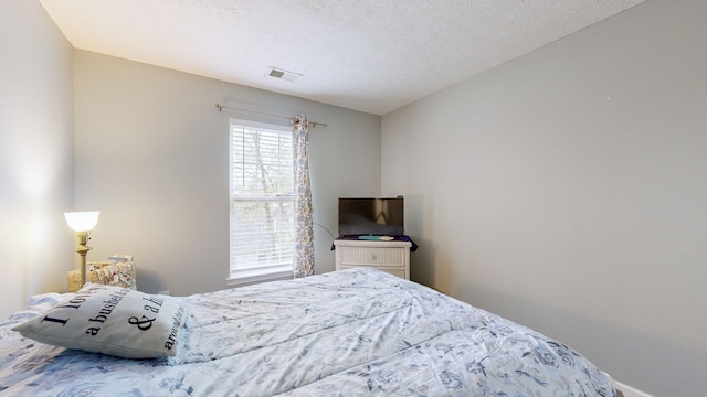 bedroom with a textured ceiling