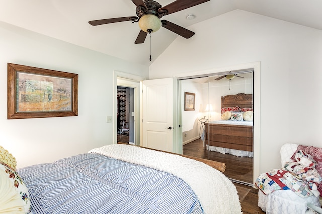 bedroom featuring dark hardwood / wood-style flooring, ceiling fan, vaulted ceiling, and a closet