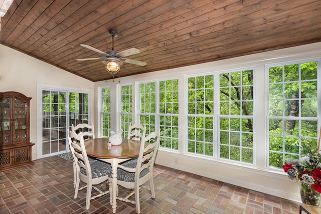 sunroom featuring wood ceiling, vaulted ceiling, and ceiling fan