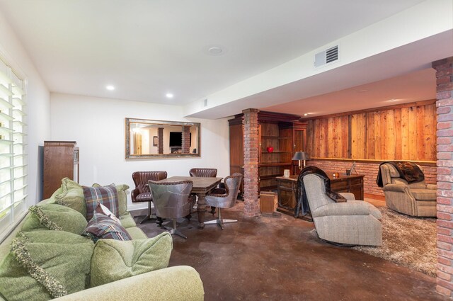 884 Pinnacle Hill Rd, Kingston Springs, TN 37082 - living room with concrete flooring, ornate columns, wood walls, and recessed lighting