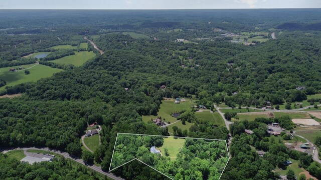 884 Pinnacle Hill Rd, Kingston Springs, TN 37082 - aerial view of property and surrounding area featuring a heavily wooded area and property parcel outlined
