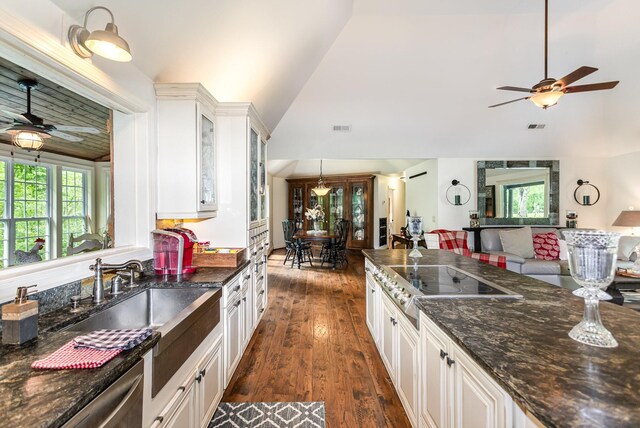 884 Pinnacle Hill Rd, Kingston Springs, TN 37082 - kitchen with a ceiling fan, black electric cooktop, white cabinetry, glass insert cabinets, and dark stone counters
