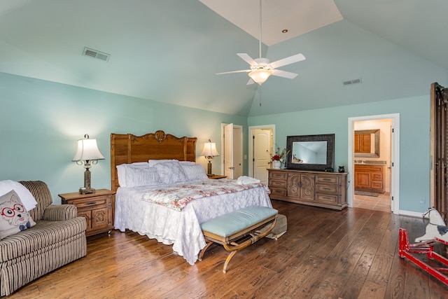 bedroom with ensuite bathroom, high vaulted ceiling, wood-type flooring, and ceiling fan