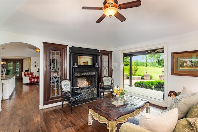 884 Pinnacle Hill Rd, Kingston Springs, TN 37082 - living area featuring ceiling fan, arched walkways, lofted ceiling, a fireplace with flush hearth, and dark wood-style flooring