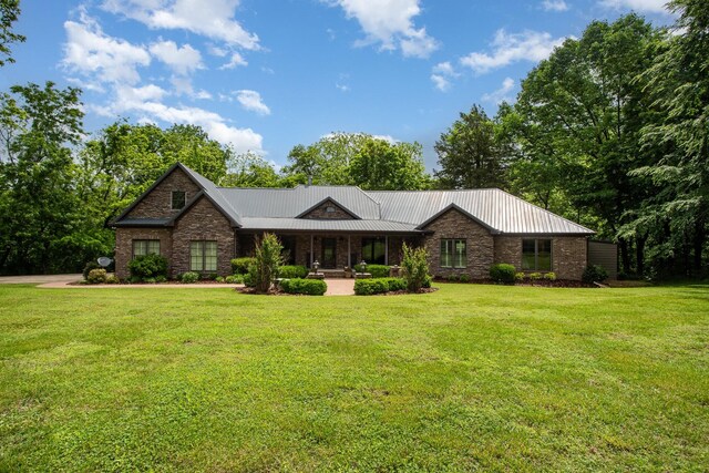 884 Pinnacle Hill Rd, Kingston Springs, TN 37082 - view of front facade with a front lawn, metal roof, and a porch