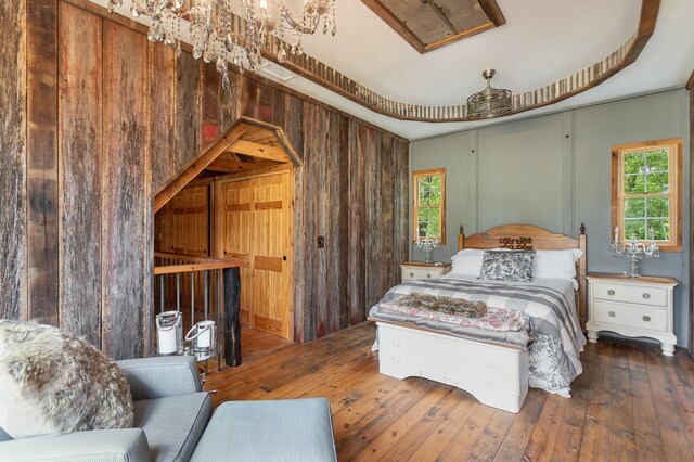 884 Pinnacle Hill Rd, Kingston Springs, TN 37082 - bedroom featuring multiple windows, hardwood / wood-style floors, and wood walls