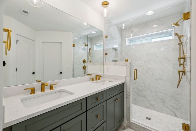 bathroom featuring vanity and a shower with shower door