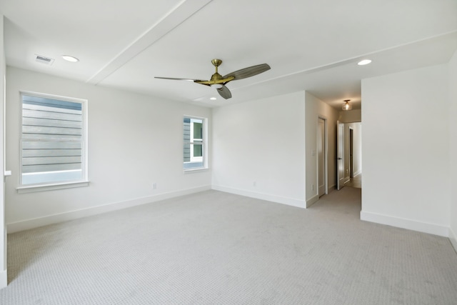 unfurnished room featuring light colored carpet and ceiling fan