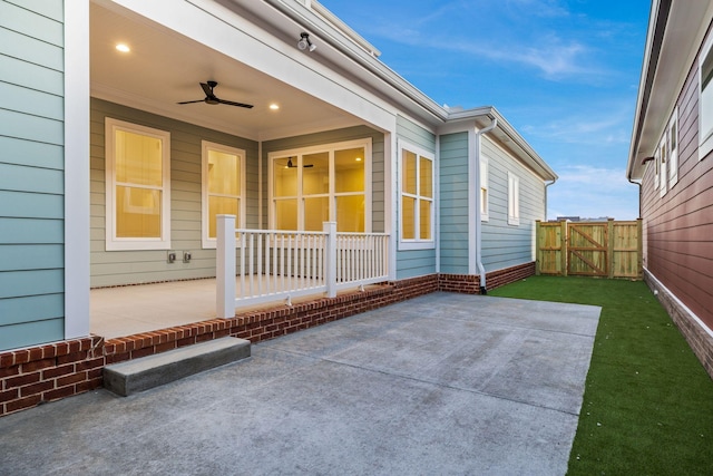 doorway to property featuring a patio area and ceiling fan