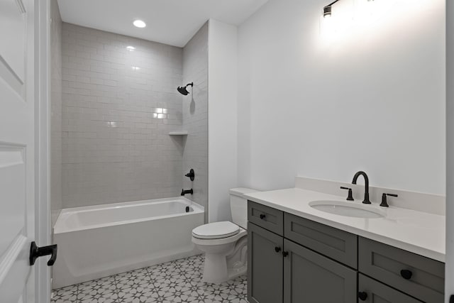 full bathroom with tiled shower / bath combo, vanity, and toilet