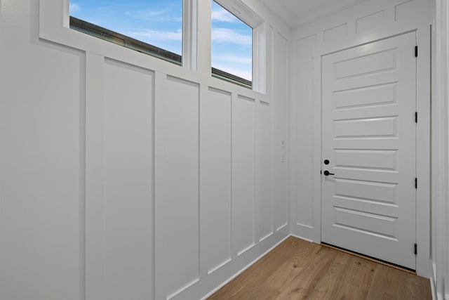 doorway to outside with light wood-type flooring