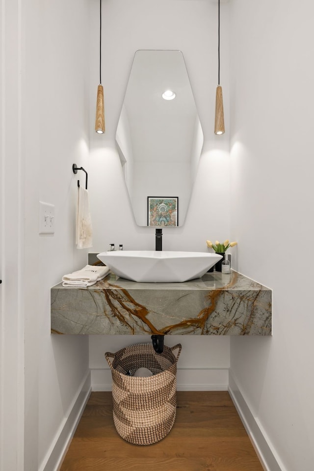 bathroom with sink and hardwood / wood-style flooring