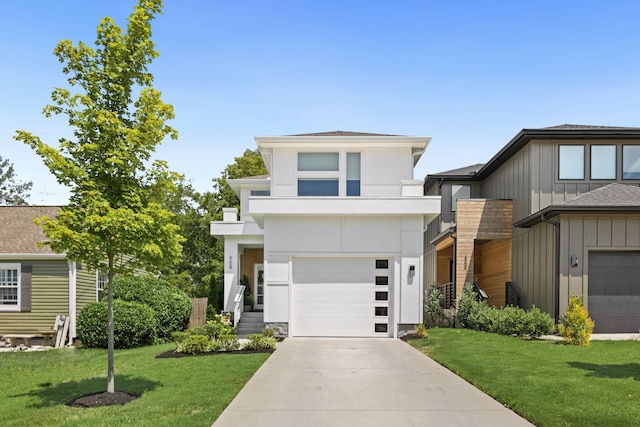 view of front of property with a garage and a front yard