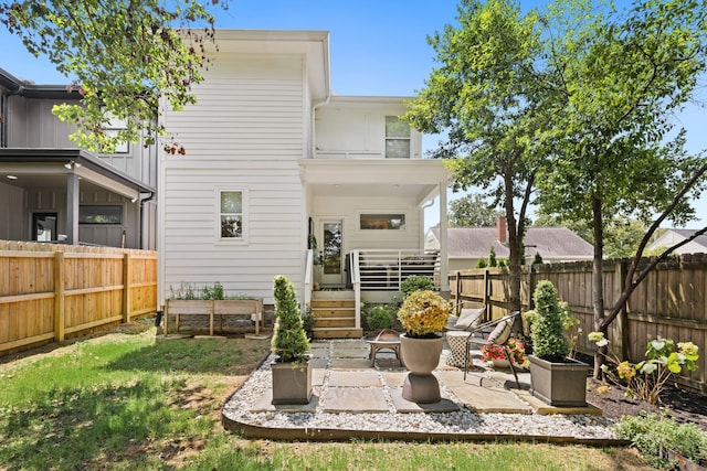 rear view of property with a patio area