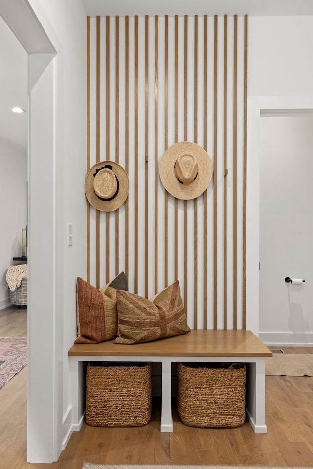 mudroom with wood-type flooring