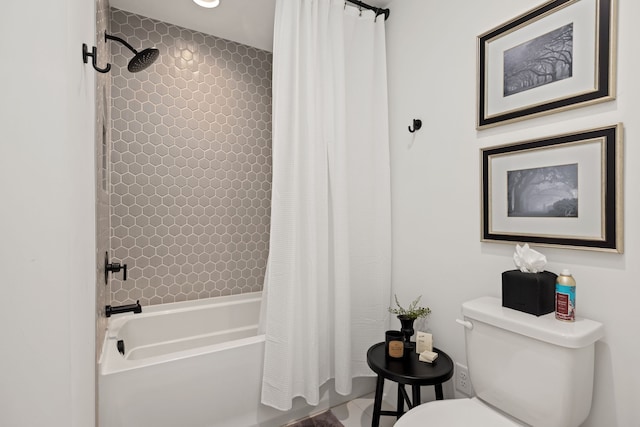 bathroom featuring shower / tub combo with curtain and toilet