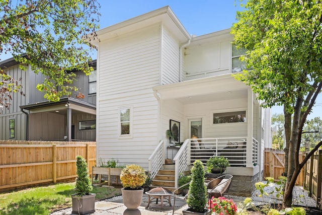 rear view of house with a fire pit