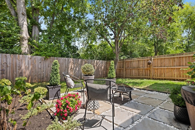 view of patio / terrace featuring a fire pit