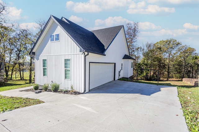 view of side of home with a garage