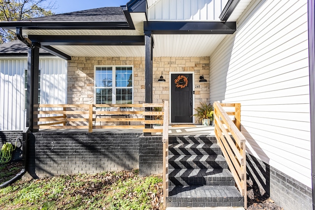 doorway to property featuring a porch