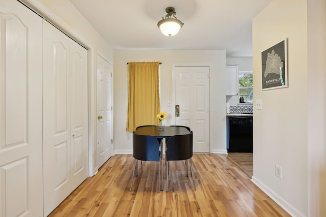 corridor featuring hardwood / wood-style floors