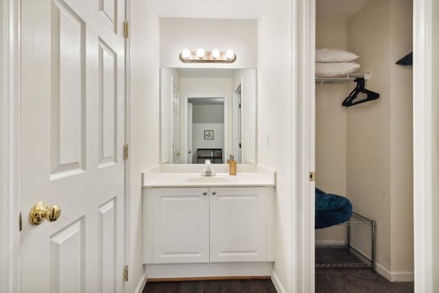 bathroom with vanity and wood-type flooring