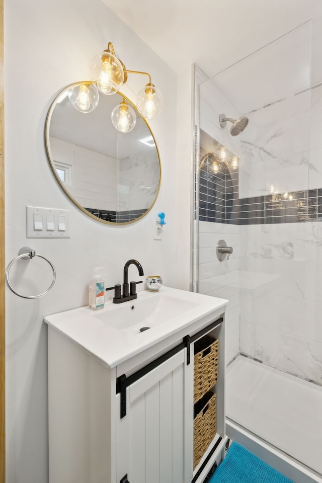 bathroom featuring vanity and tiled shower