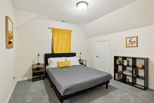 bedroom with carpet and vaulted ceiling