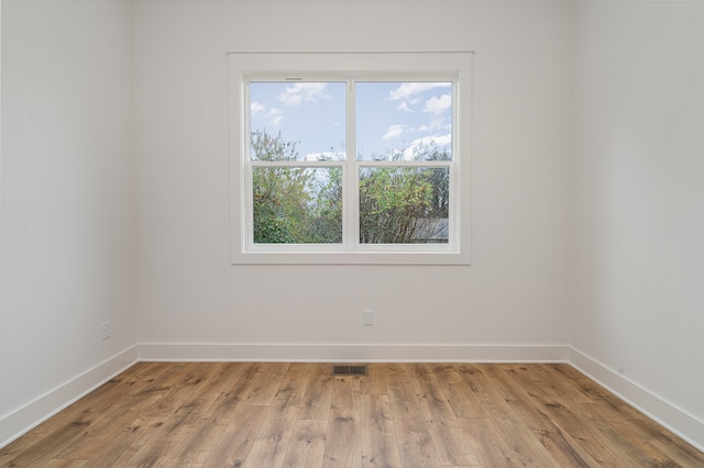 unfurnished room featuring light hardwood / wood-style floors