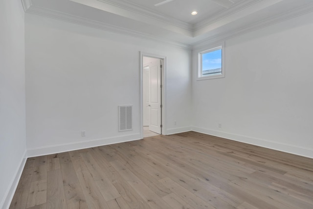 spare room featuring baseboards, visible vents, wood-type flooring, crown molding, and recessed lighting