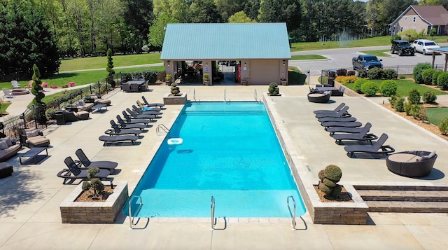 view of swimming pool with a patio area